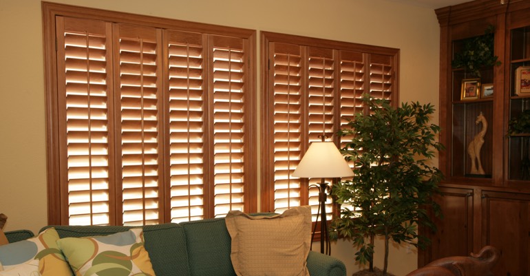 Wood shutters in Denver living room.